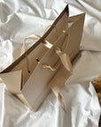 Geschenketasche mit Schleifband beige 28x20x10 cm