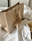 Geschenketasche mit Schleifband beige 28x20x10 cm